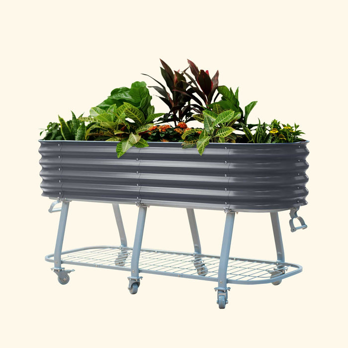 Dark grey corrugated metal raised garden bed on wheels, filled with diverse plants, featuring a lower storage shelf.