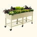 Elevated beige metal planter box on wheels with a storage shelf, holding colorful flowers and leafy green vegetables.