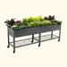 Mobile dark gray corrugated metal raised garden bed with mixed plants, lower shelf, and wheels. Patio vegetable planter.