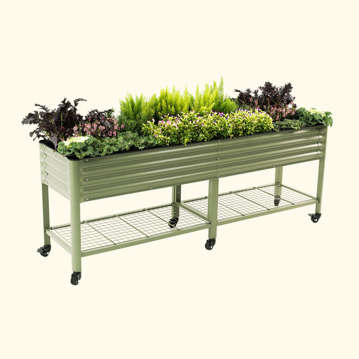 Sage green rolling metal raised garden bed with wire shelf, filled with vibrant kale, herbs, and small flowers.