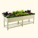 Elevated corrugated steel raised garden bed with diverse plants, lower storage shelf. Ideal for patio, herbs, vegetables, flowers.