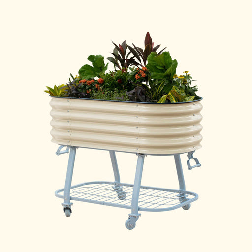 Mobile raised garden bed: cream corrugated planter with colorful plants, on a blue wheeled stand with a shelf.