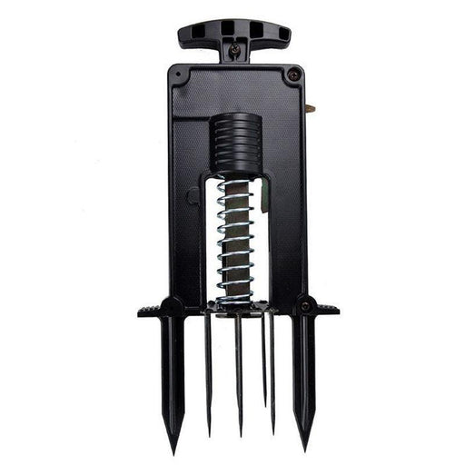 Black spring-loaded dibber for gardening. Features T-handle and five soil spikes for efficient planting.