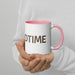 Person holding a white ceramic mug with pink handle & rim, displaying "DTIME" in brown text. Cozy coffee or tea cup.