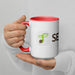 White coffee mug with red handle, green sprout from seed logo, and "SEED" text. Branded drinkware.