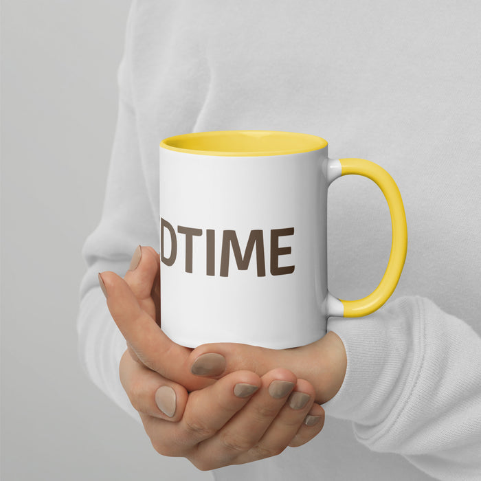 White ceramic mug with yellow handle and rim, held by hands. Features brown text "DTIME". Ideal for coffee or tea.