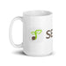 White ceramic coffee mug with green sprout logo, brown seed, and "SEED" branding.