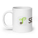 White coffee mug with green seed sprout logo and "SEED" text.