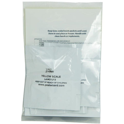 Pest Wizard yellow scale pheromone lure packets, sealed in clear bag with instructions for insect pest control.
