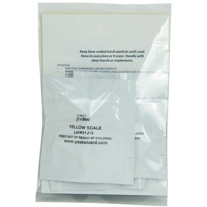 Pest Wizard yellow scale pheromone lure packets, sealed in clear bag with instructions for insect pest control.