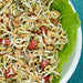 Nutritious mixed sprouts salad with bean, lentil, and peanut sprouts, served in a white bowl lined with lettuce. Healthy vegan.