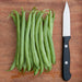 Vibrant green beans piled beside a sharp kitchen knife on a rustic wooden cutting board for fresh vegetable prep.